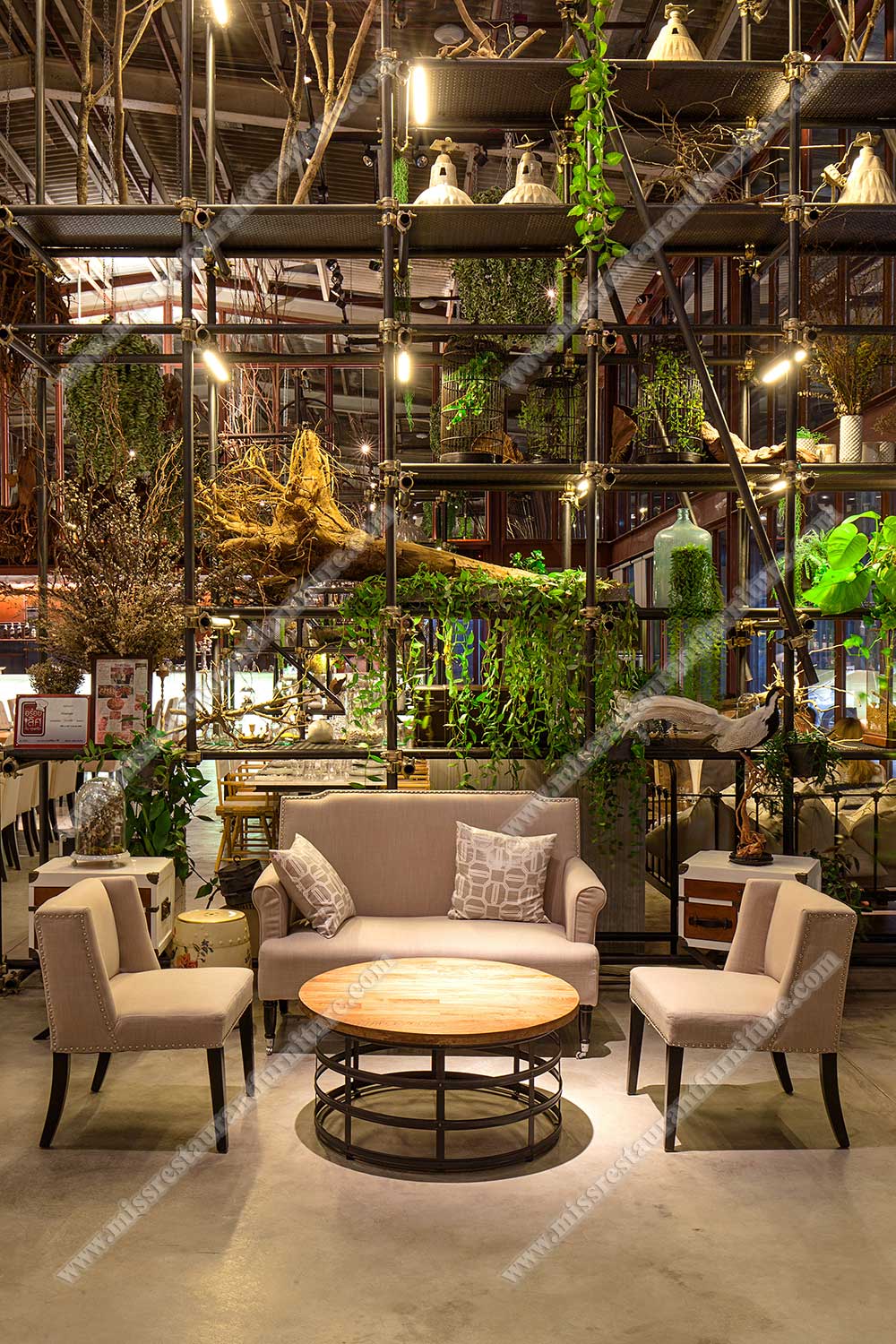 Tailand Bangkok Vivarium restaurant furniture_round wood restaurant table and nails decor fabric sofas